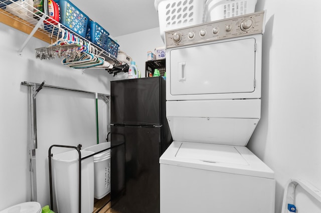 laundry room with stacked washer / dryer