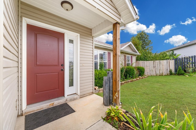 doorway to property featuring a yard