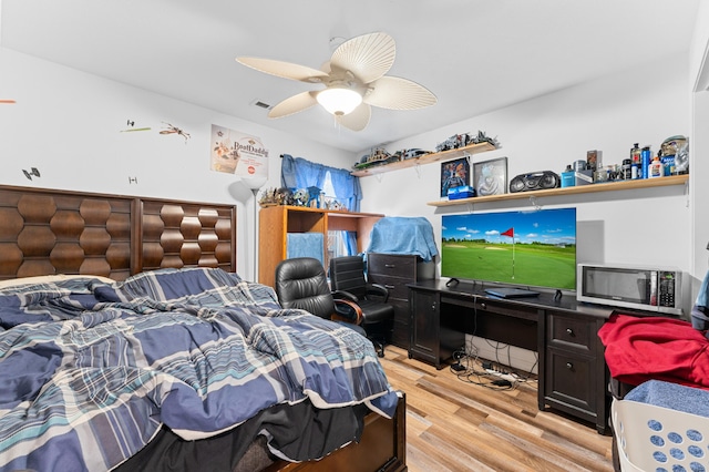 bedroom featuring ceiling fan and light hardwood / wood-style floors