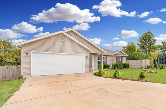 view of front of house with a garage and a front lawn