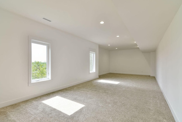 unfurnished room with light carpet