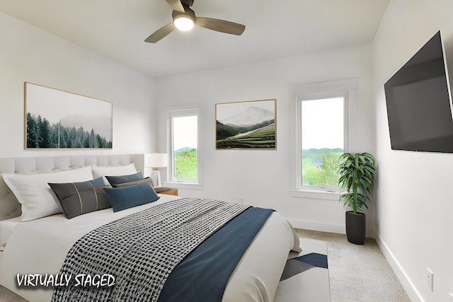 carpeted bedroom with ceiling fan