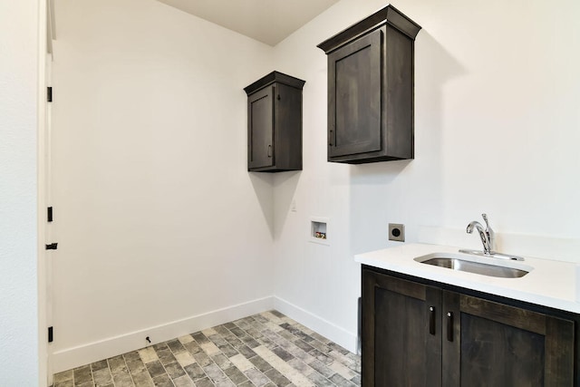 laundry room with washer hookup, hookup for an electric dryer, sink, and cabinets