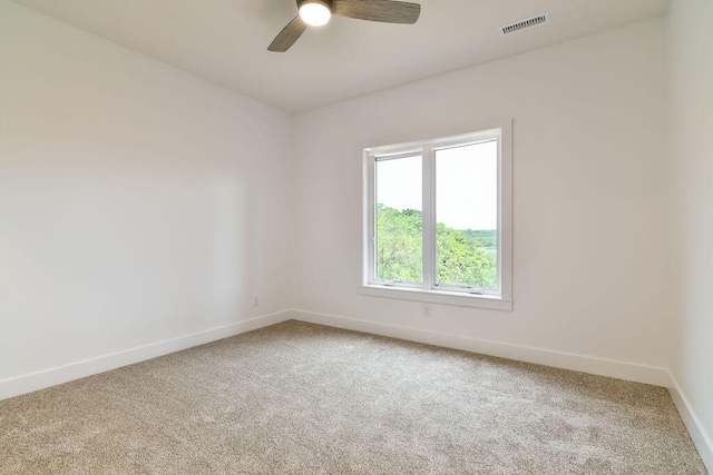 carpeted empty room with ceiling fan