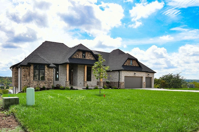 view of front facade featuring a front yard and a garage