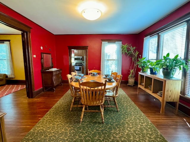 dining room with dark hardwood / wood-style floors