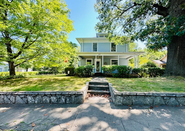 view of front of property featuring a front lawn