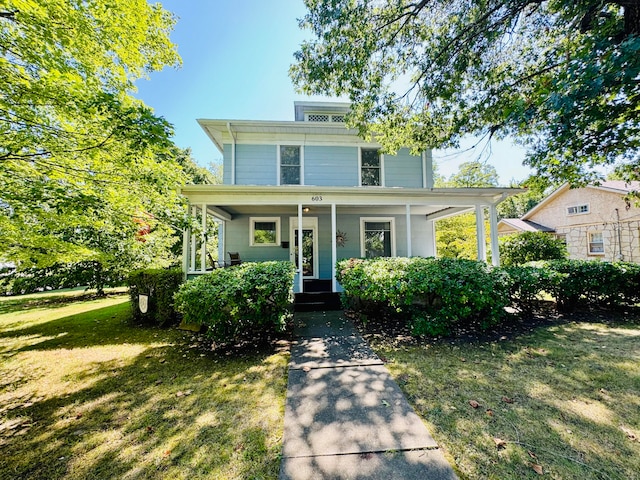 view of front of property featuring a front lawn