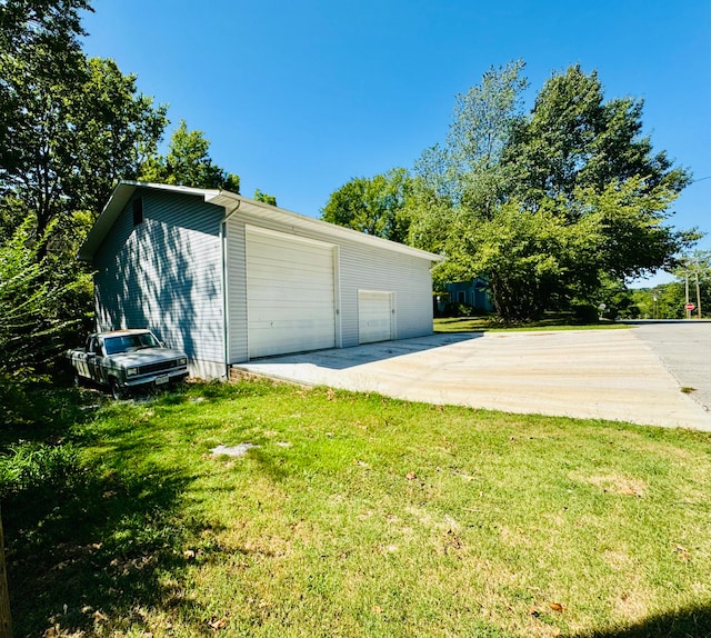 garage with a yard