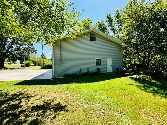 view of home's exterior with a yard