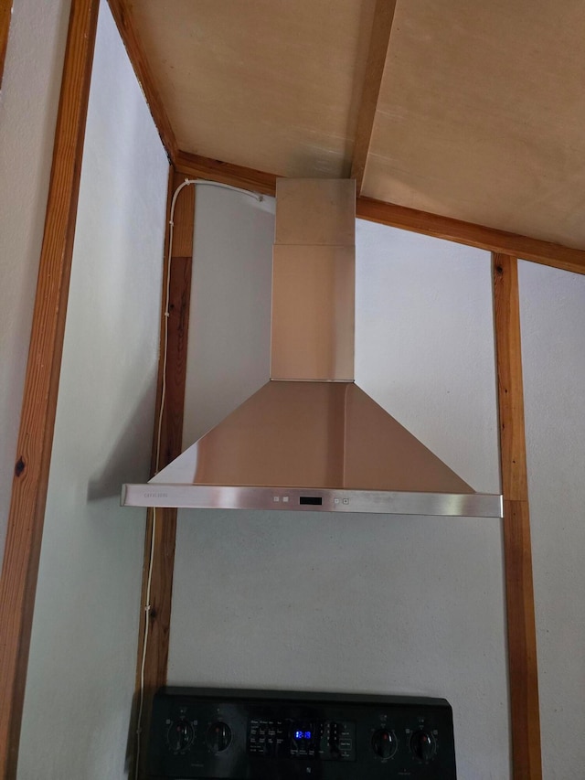 room details featuring wall chimney range hood