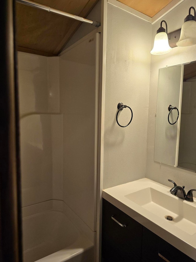 bathroom with vanity and bathing tub / shower combination