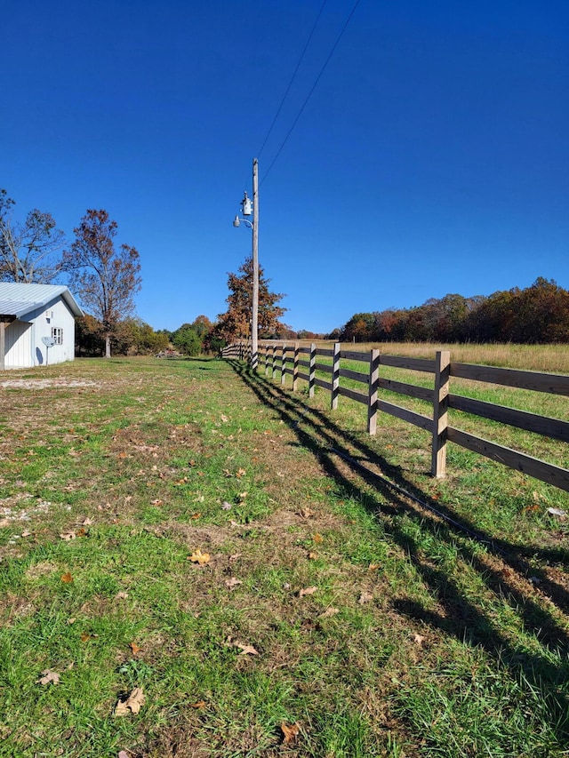 view of yard with a rural view