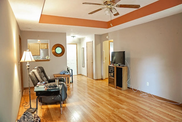 sitting room featuring ceiling fan and light hardwood / wood-style floors