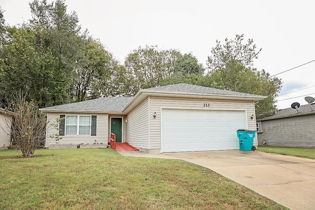 single story home featuring a garage and a front yard