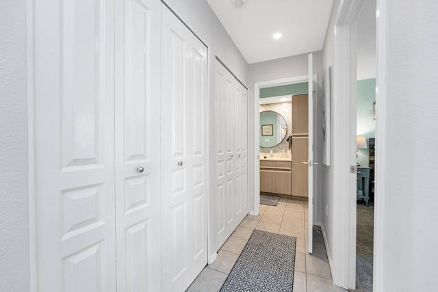 hall with light tile patterned flooring