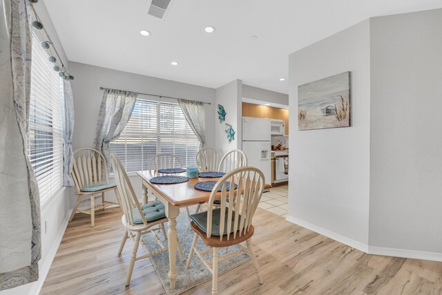 215 Meadow Brook Ln Unit 1, Branson, MO 65616 - dining space featuring baseboards, light wood-style floors, and recessed lighting