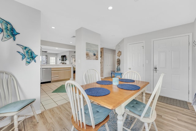 dining area with light hardwood / wood-style floors