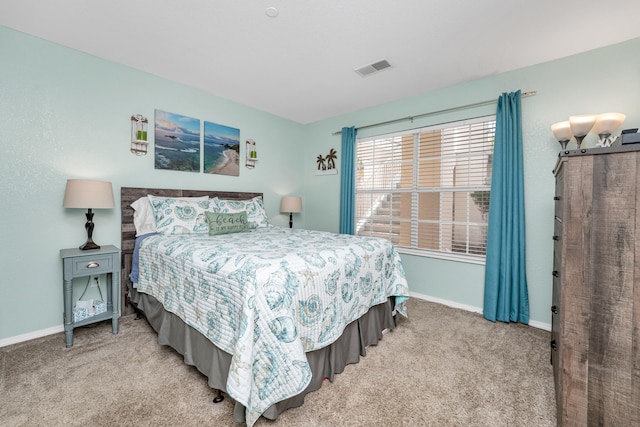 bedroom with light colored carpet