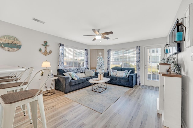 215 Meadow Brook Ln Unit 1, Branson, MO 65616 - living area with light wood-type flooring, visible vents, and a ceiling fan