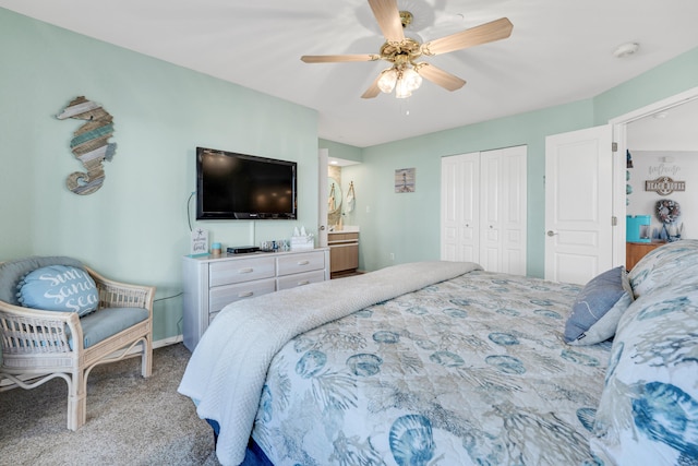 bedroom featuring ceiling fan, a closet, and carpet