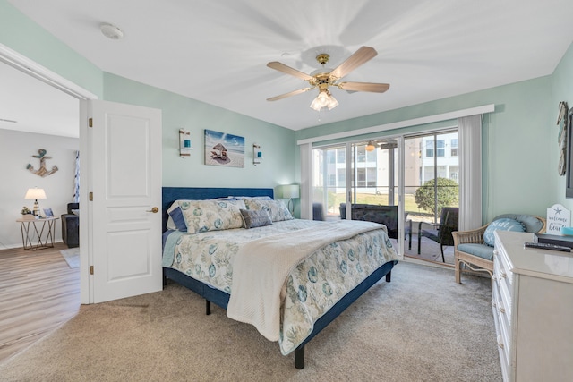 bedroom featuring access to outside, light colored carpet, and ceiling fan