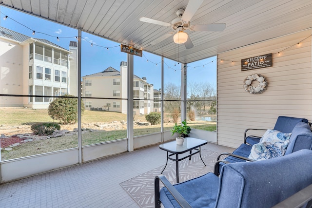 sunroom / solarium with ceiling fan