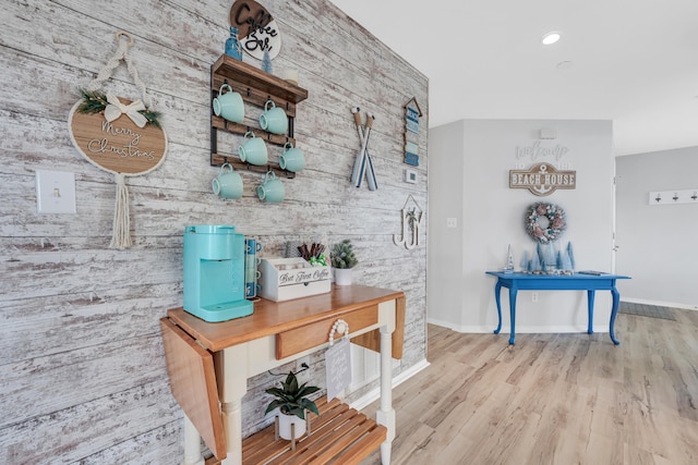 215 Meadow Brook Ln Unit 1, Branson, MO 65616 - corridor featuring an accent wall, wood finished floors, wooden walls, baseboards, and recessed lighting