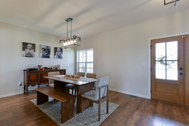 dining area featuring dark hardwood / wood-style floors