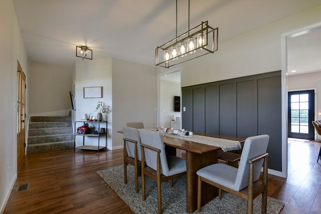 dining space featuring dark hardwood / wood-style flooring