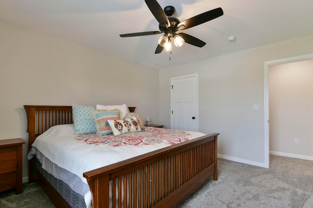 bedroom featuring ceiling fan and light colored carpet