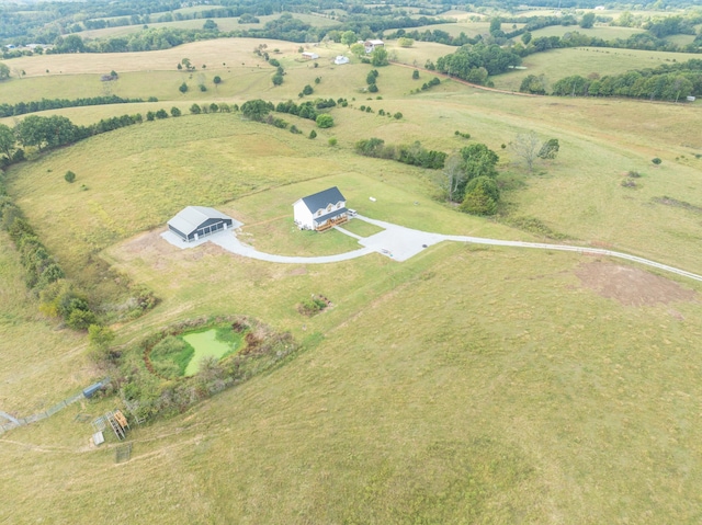 birds eye view of property featuring a rural view