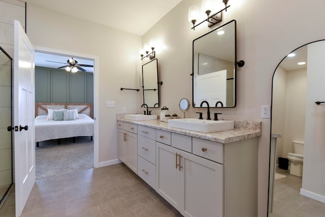 bathroom with ceiling fan, tile patterned floors, toilet, and vanity