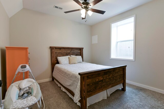 carpeted bedroom featuring ceiling fan and vaulted ceiling