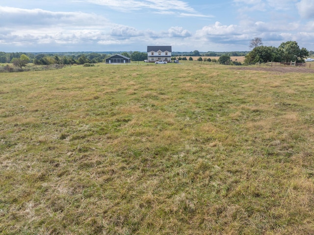 view of yard with a rural view