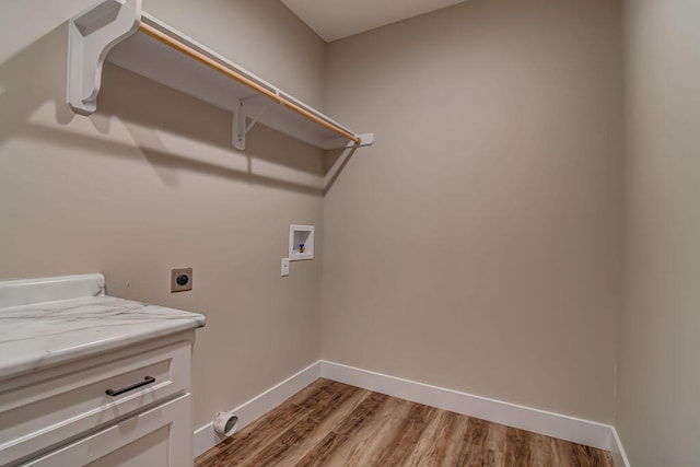 clothes washing area with washer hookup, light hardwood / wood-style flooring, and electric dryer hookup