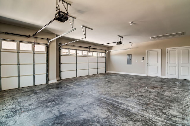 garage featuring a garage door opener and electric panel