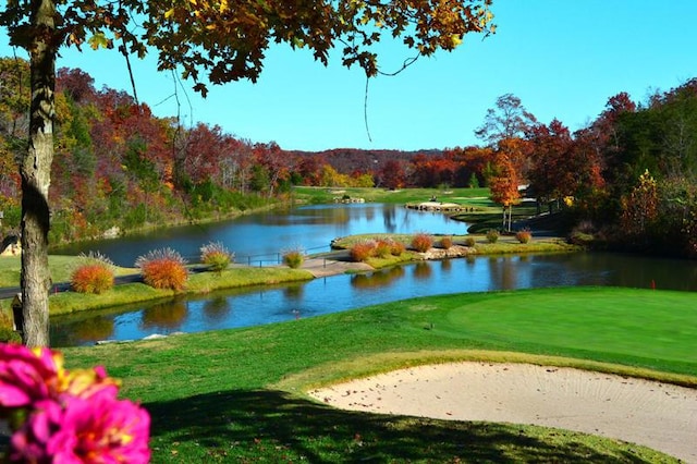 162 Mountain View Cir, Branson West, MO 65737 - view of community featuring golf course view, a view of trees, a water view, and a yard