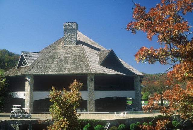162 Mountain View Cir, Branson West, MO 65737 - back of property with roof with shingles and a chimney