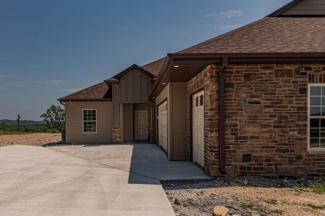 162 Mountain View Cir, Branson West, MO 65737 - exterior space featuring stone siding and roof with shingles