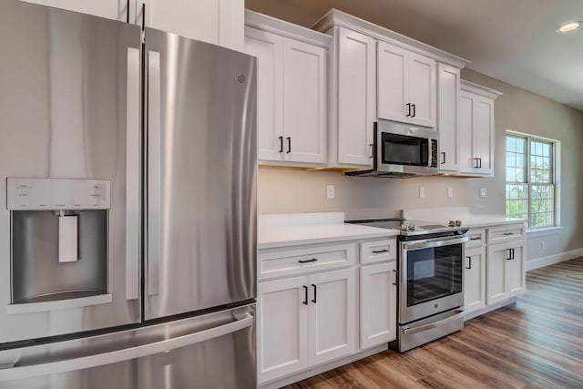 162 Mountain View Cir, Branson West, MO 65737 - kitchen featuring light countertops, white cabinetry, light wood-style floors, and appliances with stainless steel finishes