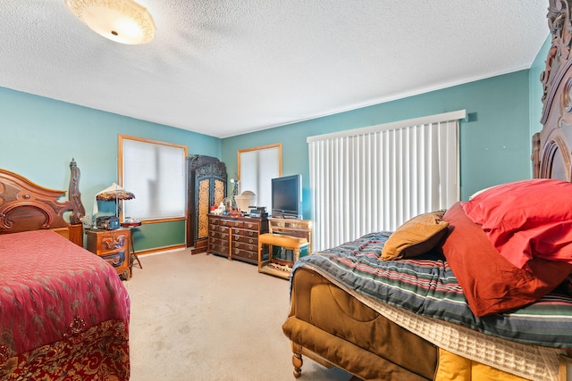 carpeted bedroom featuring a textured ceiling