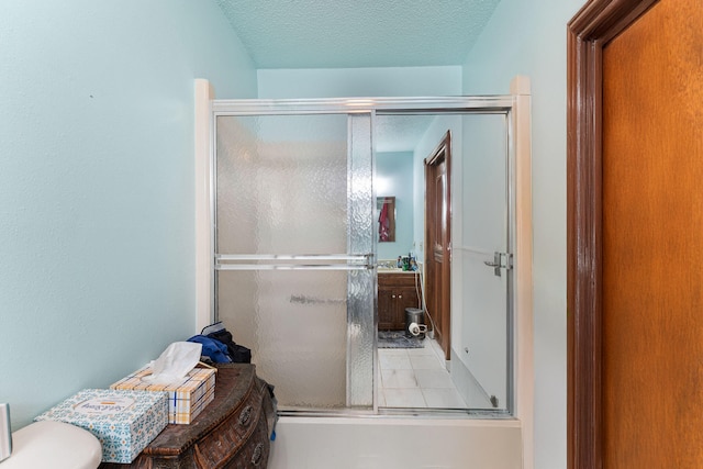 bathroom featuring a textured ceiling and toilet