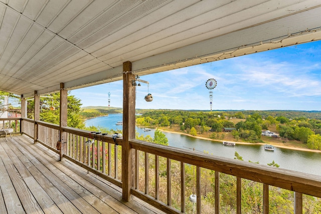 wooden deck with a water view