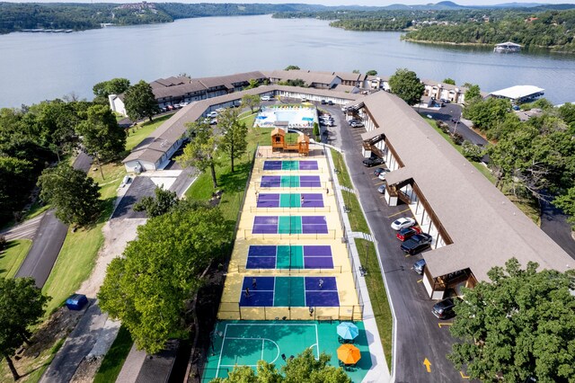 birds eye view of property with a water view