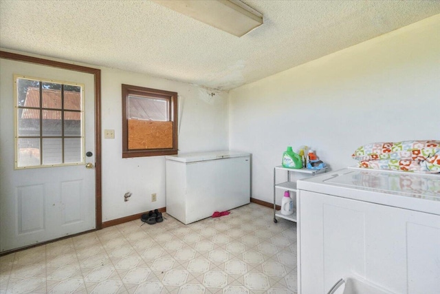 laundry room with a textured ceiling