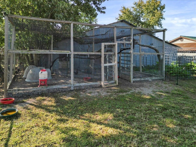 view of outbuilding with a yard