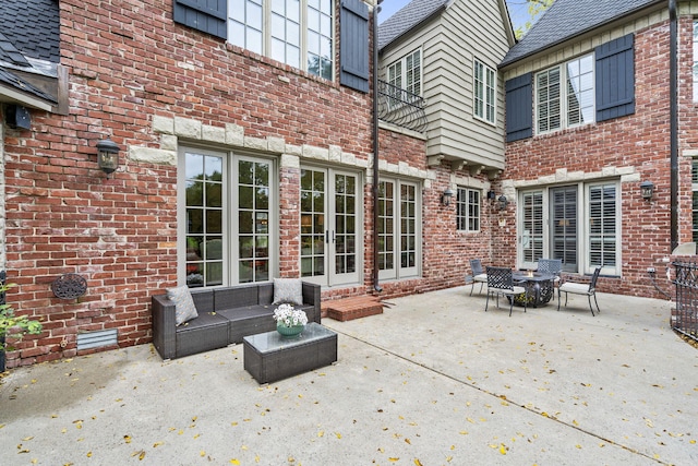 view of patio with outdoor lounge area and french doors