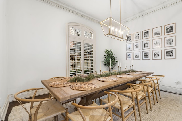 dining area featuring an inviting chandelier and hardwood / wood-style flooring