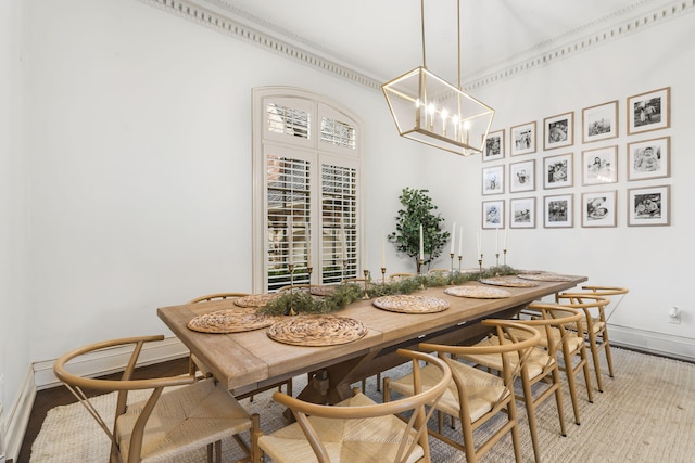 dining area featuring baseboards, a chandelier, and a wealth of natural light